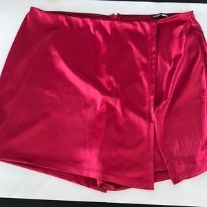 Red hot pinkish polyester and spandex skort lightly worn